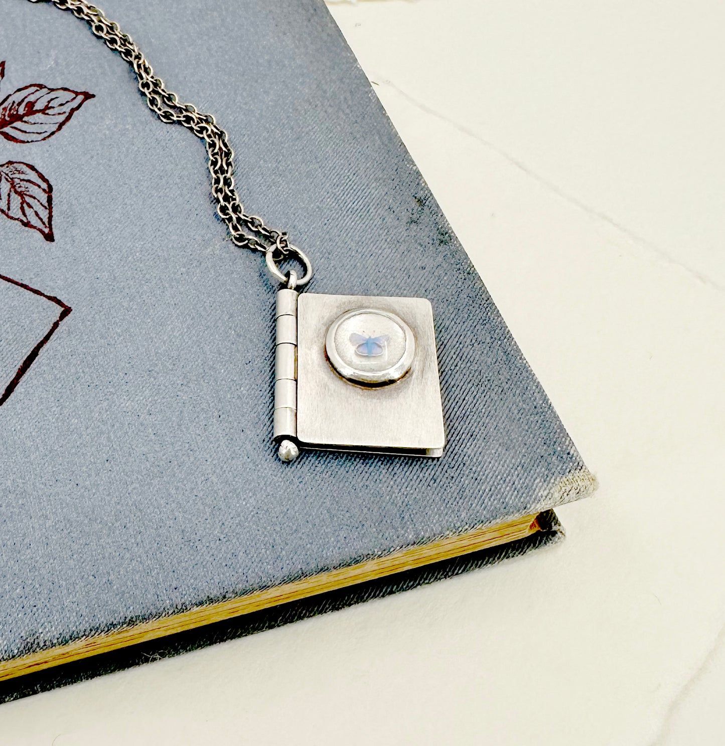 All Shall Be Well Sterling Book Locket with Tiny Blue Butterfly